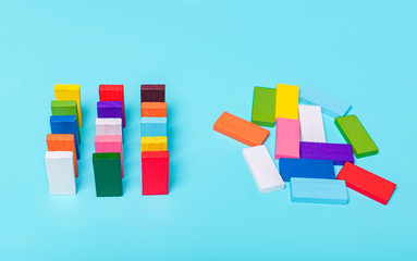 order and chaos. Chaotic unorganized colored dominoes and ordered. Concept of business model,...