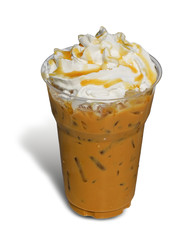 Iced coffee covered with whipped cream caramel in plastic glass to go isolated on white background. This has clipping path.          