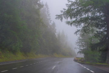 Fototapeta premium Scenic foggy road at Grossglockner mountain pass, Austria