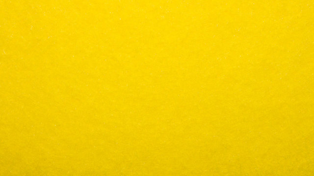 Bright yellow sunny fabric texture.Yellow velvet fabric background.