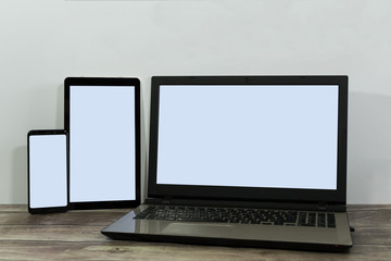 Laptop, mobile and tablet with blank screen for responsive design