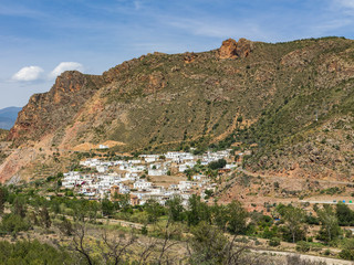 Fototapeta na wymiar Darrical, small town surrounded by mountains in southern Spain
