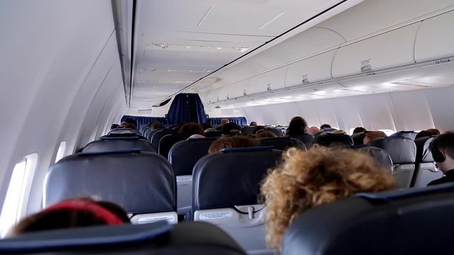 KYIV, UKRAINE - Juny 11, 2017. people are sitting on the plane their faces are not visible. everyone is sitting quietly during the flight