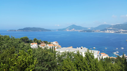 blue Adriatic sea and green hills near Budva and Becici - resort of Montenegro