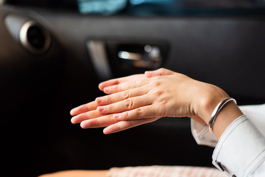 Woman Using Hand Sanitizer In The Car For Hands Disinfection While Outdoors