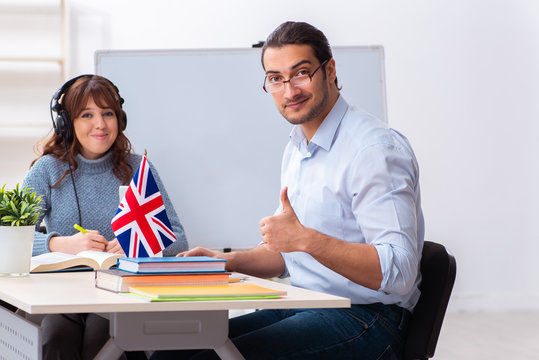 Young Female Student And Male English Teacher In The Classroom