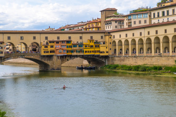 Fototapeta premium View of the bridge Ponte Vecchio and a Vasari Corridor in Florence, Tuscany, Italy