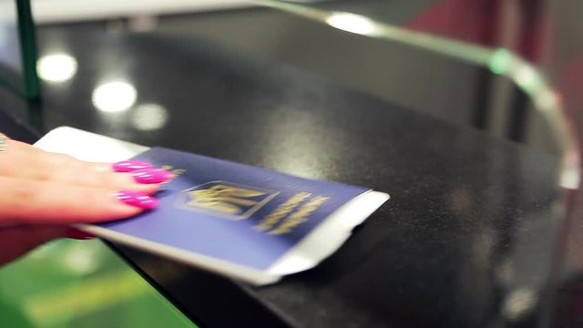 the passenger gives and picks up the passport. The border officer scans. database search during id scan