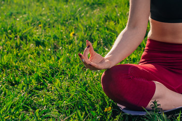 Hands closeup namaste. young Caucasian girl practices yoga meditation in the fresh air. The concept of peace of mind.