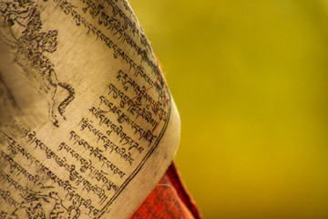 Portion of a prayer tibetan flag with copy space