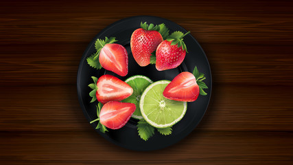 Sliced lime and strawberries on a dark plate and wooden table.