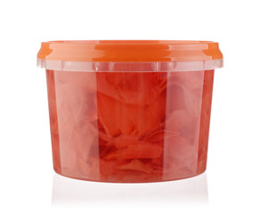 Pickled ginger in a plastic bowl isolated.