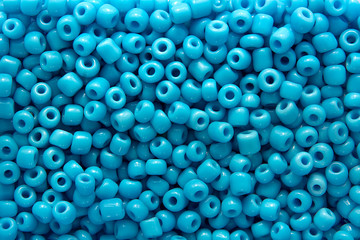 background of large blue beads in a disfocus with blur for collage
