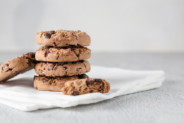 Pile of chocolate chip cookies on some napkins. Clean style