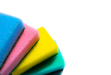 Colorful sponges for washing dishes on white background. Artificial fiber not eco-friendly tool. Things for kitchen.