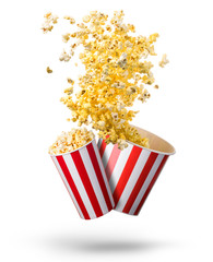 Set of flying popcorn from paper striped buckets isolated on white background