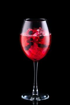 Cold Sangria With Forrest Berries In A Wine Glass Isolated On Black Background