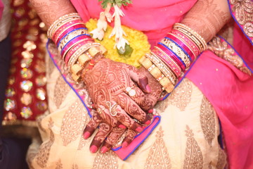 Fototapeta premium indian wedding, mehandi, holding hands, pooja, function, ritual, ring, marriage, traditional