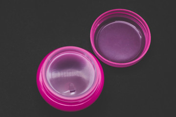 Packaging for cream pink empty on a black background