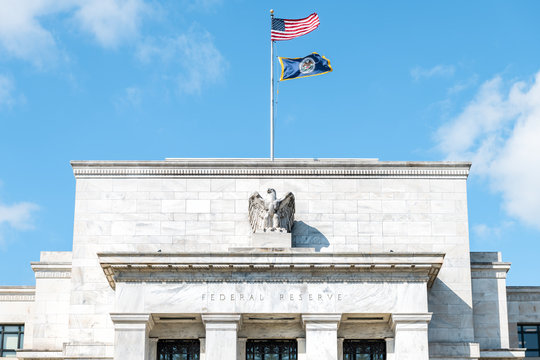 Washington DC, USA - March 9, 2018: Closeup Of Federal Reserve Bank Facade Entrance, Architecture Building, Eagle Statue American Flags, Blue Sky At Sunny Day