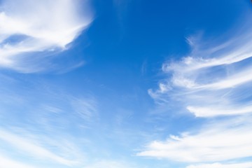 Naklejka na ściany i meble White cirrocumulus clouds in the blue sky. Beautiful sky background