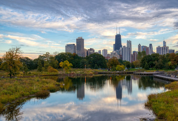  Chicago skyline with reflection in lake in foreground shot from Lincoln Park 