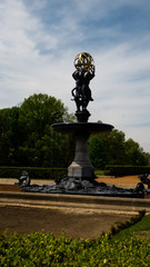 Fototapeta na wymiar Sculpture and fountain Three Graces by Emmanuel Fremiet in Świerklaniecki Park. Ready free entry space.