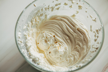 Whipped cream in a plate. View from above
