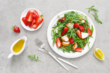 Strawberry salad with arugula and chicken meat