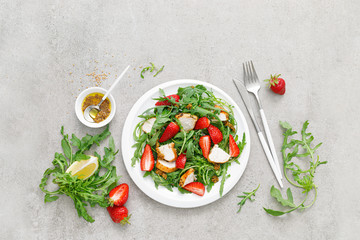 Strawberry salad with arugula and chicken meat