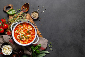 Cooking pasta e fagioli soup with chicken meat and vegetables, italian cuisine