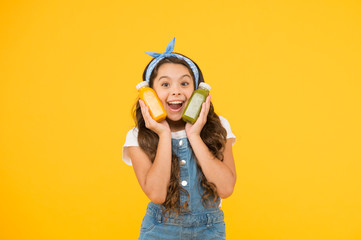 Hand crafted smoothie recipe. Fruit energy. Smiling kid hold smoothie bottles. Healthy food....