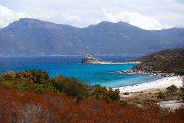 Horizontal view. Top view of the Corsica, France, mountains and turquoise sea background.