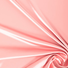 Pink silk fabric as background. Smooth elegant pink silk, satin texture. Flat lay, top view, copy space
