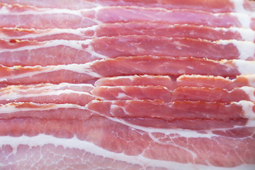 Bacon slices close-up, raw beef bacon texture