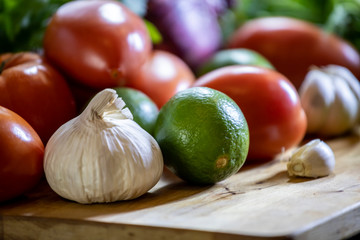 close up view of African woman hands reaching for a fresh vegetables and lines siting on the...