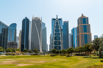 Plakat Panoramic view of Dubai skyscrapers in UAE. Dubai Marina prestigious residential area of Dubai close to the sea. Concept of financial success and luxury lifestyle.