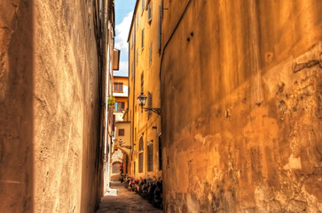 Traditional Italian Alley with Housing and Summer Sun in Florence, Italy