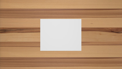 Blank landscape sheet of paper on beech wood table