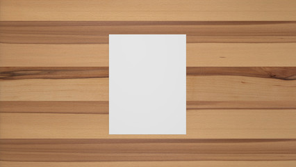Blank portrait sheet of paper on beech wood table