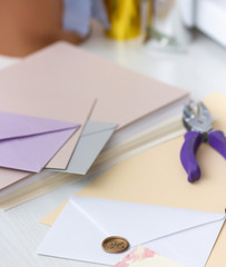 A sealed envelope with a wax seal with the word - love. Envelope close-up on a blurred background.