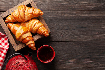 Fresh tasty croissants and tea