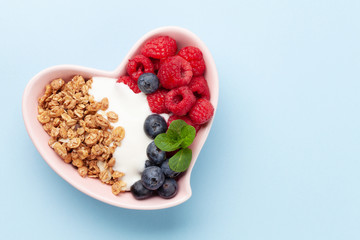 Healthy breakfast with granola, yogurt and berries