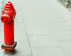 red old metal water hydrant in Europe city on the street