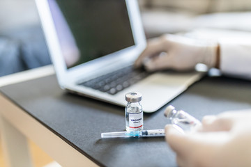 unrecognizable doctor's office, covid-19 vaccine