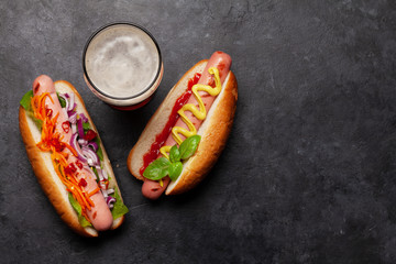 Various hot dog and glass of beer