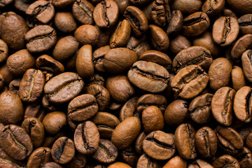 Fully filled frame with coffee beans, dark photo
