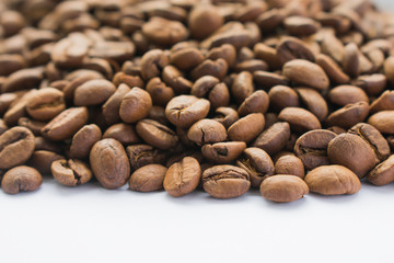 The top part of the frame is coffee beans, and the bottom is a white background, perfect for advertising