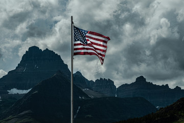 0000303_Old Glory, American Flag, waving over Swiftcurrent lake atGlacier National Park,...