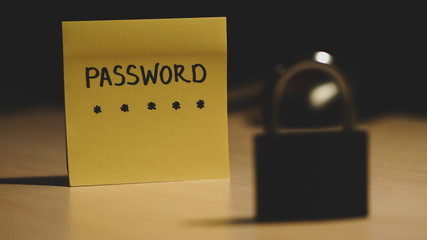 Secret password written on paper note on background. Login access, encryption and cyber security...